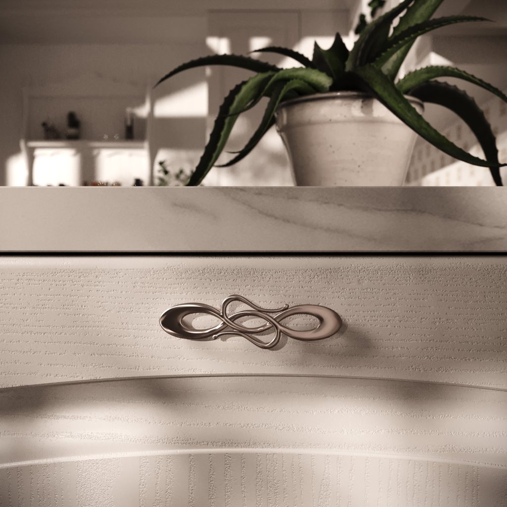 Dettaglio della maniglia decorativa sull'anta decape della cucina Classic & Contemporary Gioconda country chic di Ciao Cucine