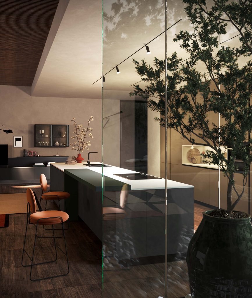 Cucina moderna economica Diamante di Ciao Cucine, veduta serale dell'isola con top chiaro vista attraverso la vetrata e ulivo
