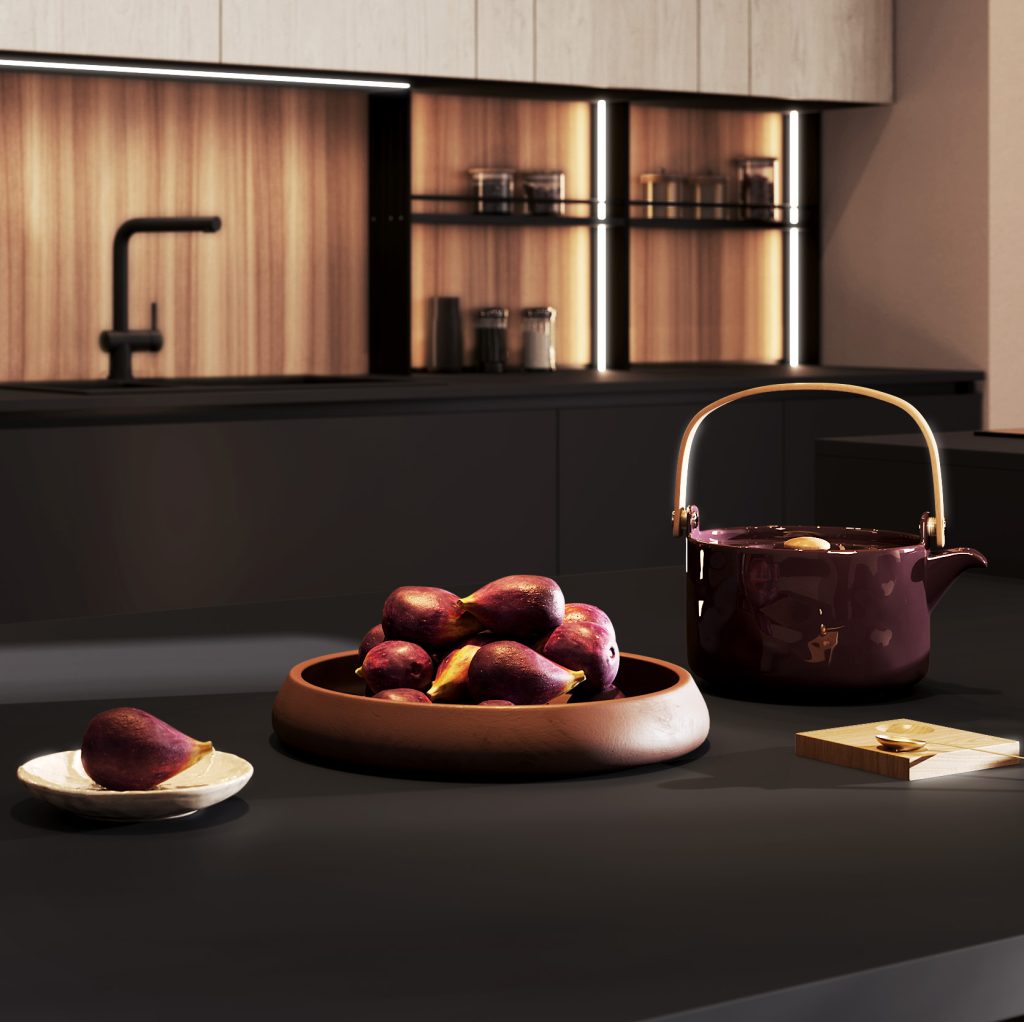 Dettaglio del piano nero della cucina Modern & Design Ginevra di Ciao Cucine con teiera bordeaux e fichi, ambiente effetto legno chiaro