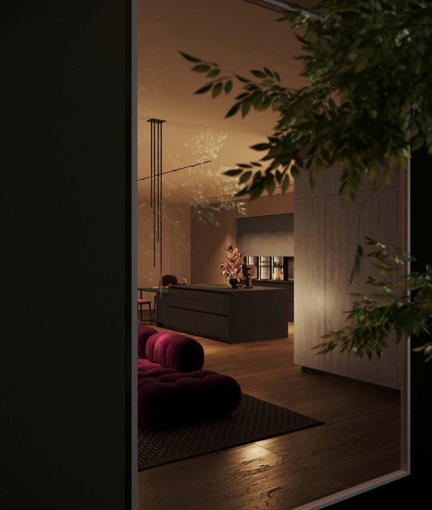 Veduta notturna della zona living con isola nera della cucina Modern & Design Ginevra di Ciao Cucine, colonne effetto legno chiaro