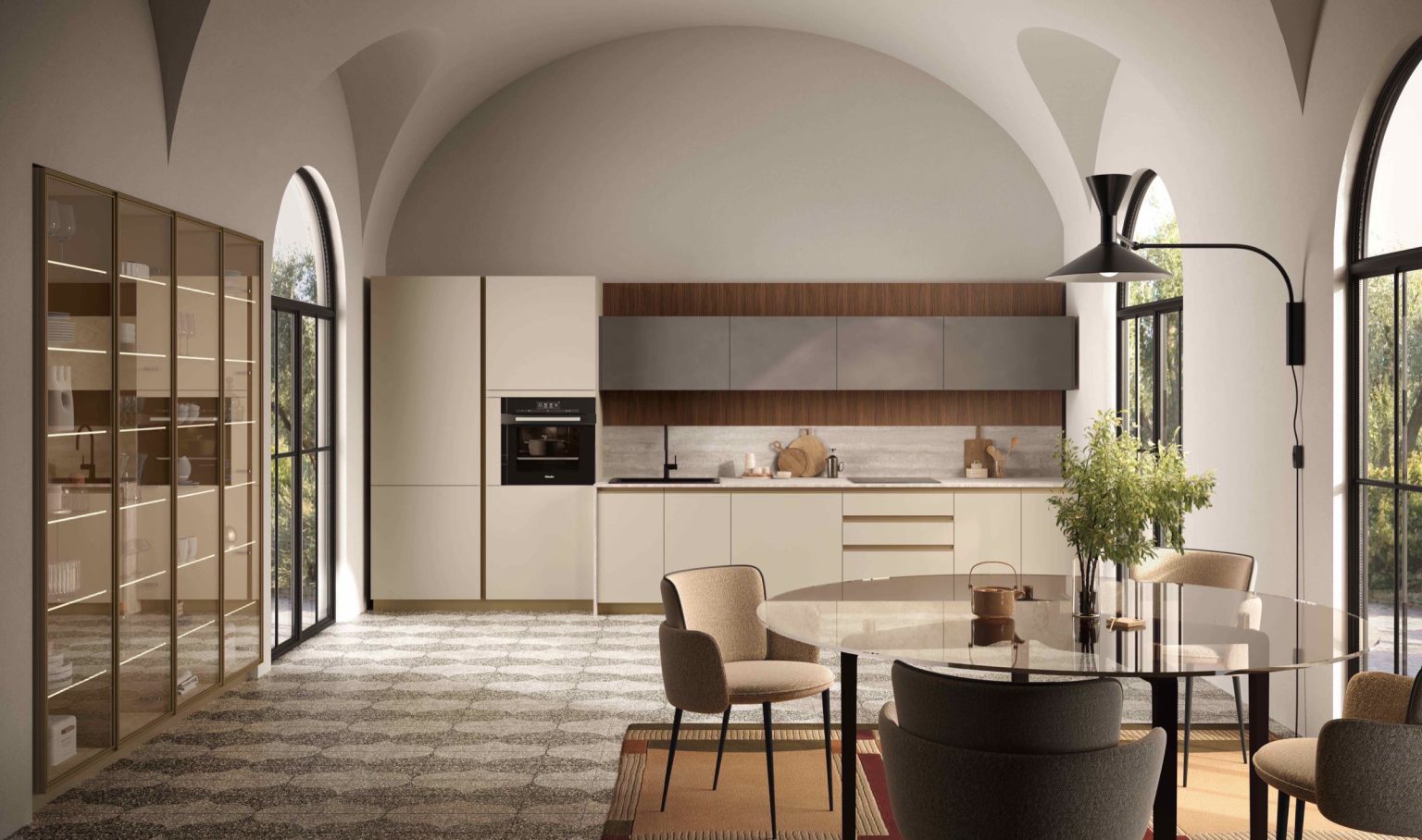Zona pranzo con tavolo tondo e cucina lineare sotto volte a botte, cucina Modern & Design Marilyn di Ciao Cucine con vetrina